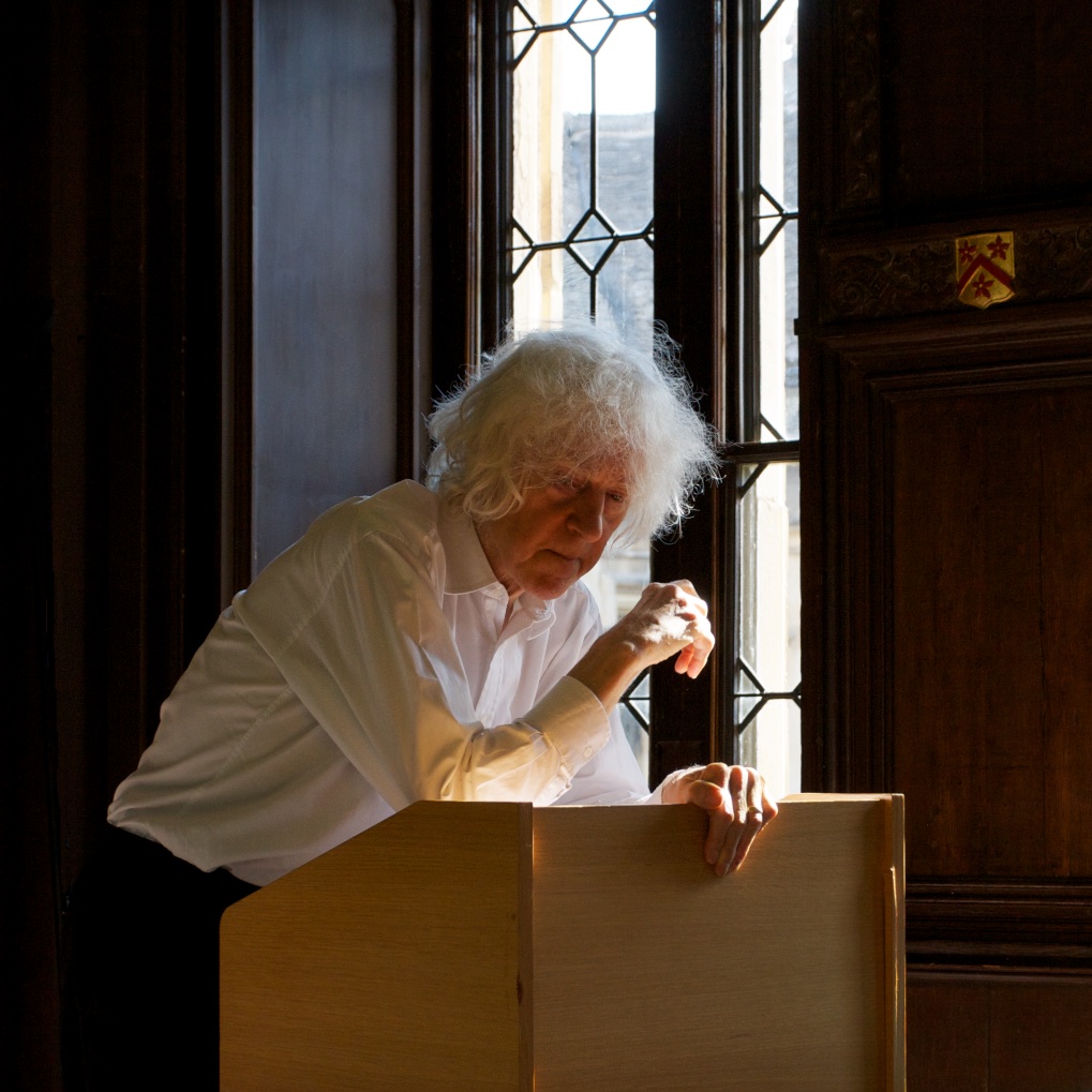 Derek Parfit speaking at the lectern, All Souls College, Oxford